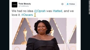 Woopi got mistaken for Oprah.  Everyone knows Oprah's tat is on her thigh
