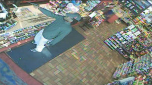 surveillance picture of armed robber -- same town just a few days ago.