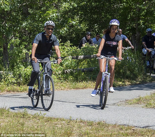 Are those Secret Service agents we see in the background, riding bicycles without helmets on?  FLOTUS Michelle will kick their  a**